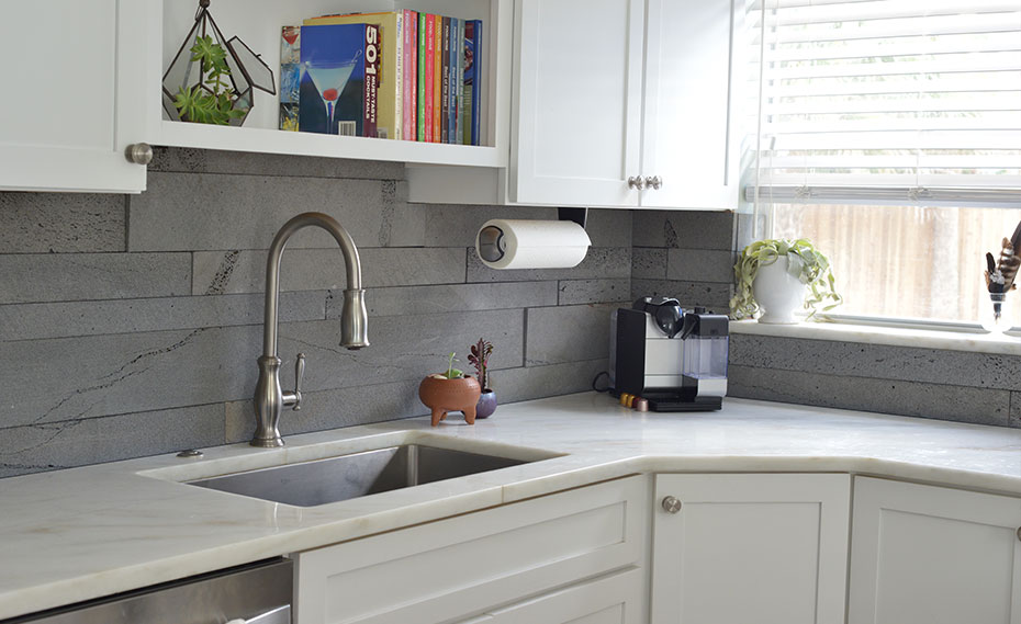 Norstone Planc Strip Veneer Backplash in a kitchen next to faucet and stove