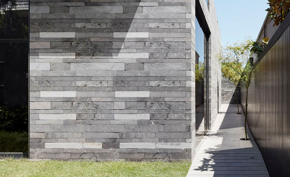 Lavastone Strip Veneer Planks Used on a Contemproary Residential Facade with Large Window