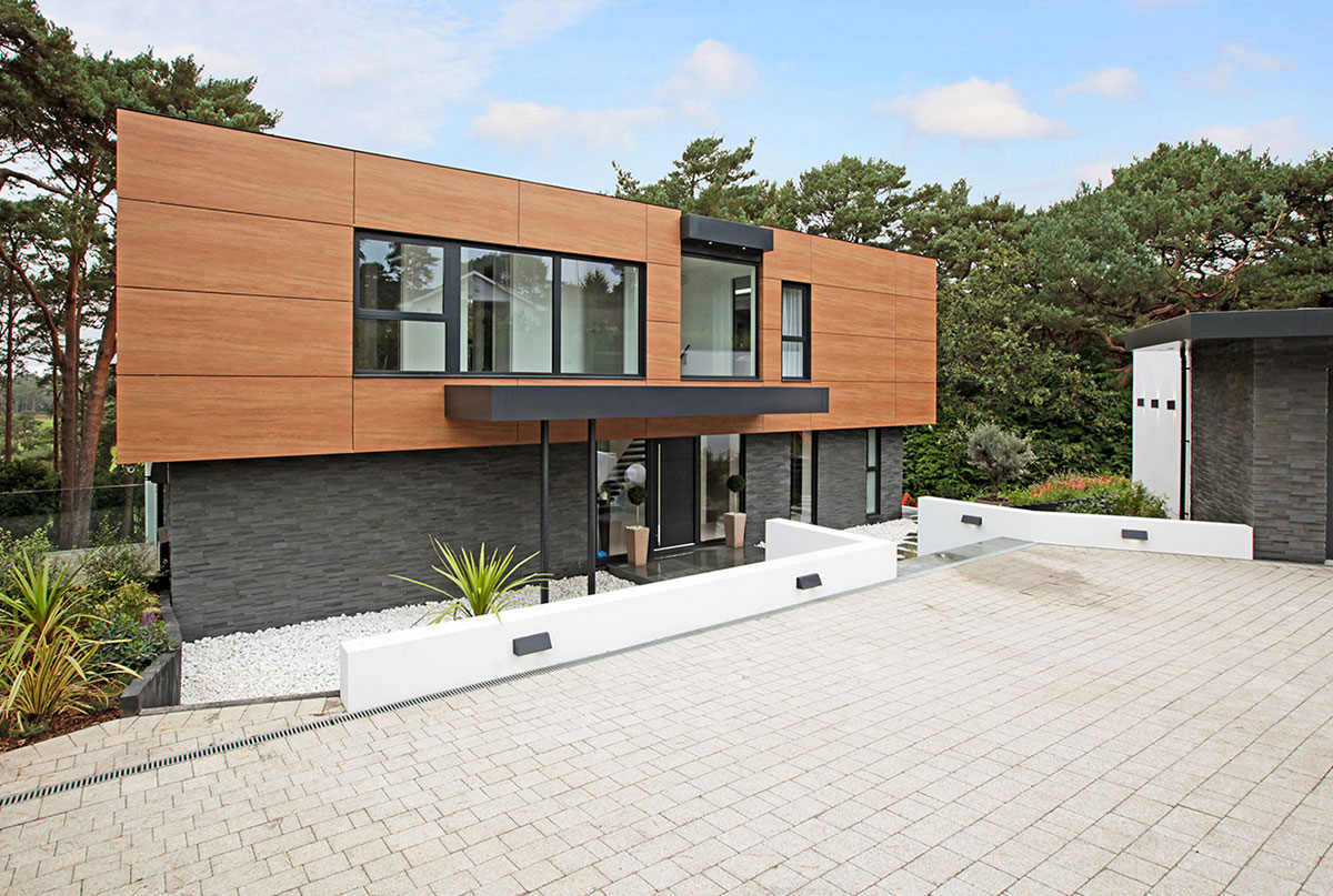 Norstone's Brand New Aksent 3D Panels in Ash Grey Basalt Stone used on an exterior facade of a home