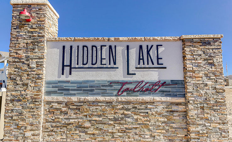 Earthy Warm Toned Stacked Stone used for Exterior Sign at Subdivision