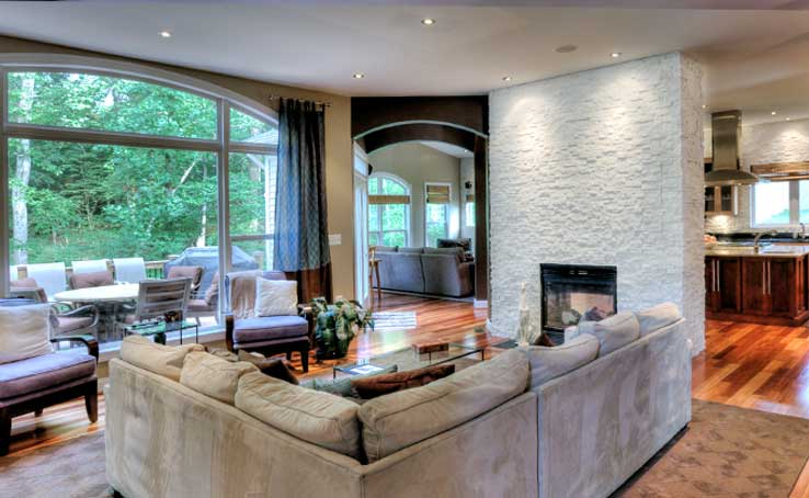 Norstone Living Room with view of Kitchen with White Stacked Stone Backsplash