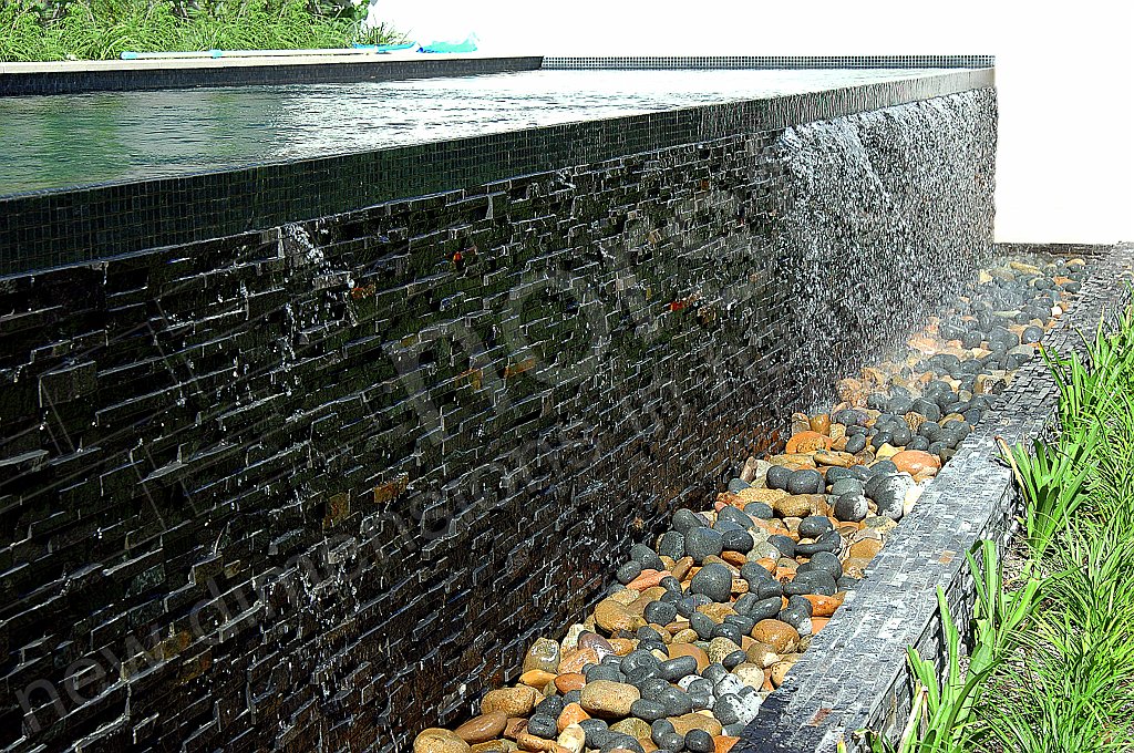 Charcoal Stacked Stone Infinity Edge Ledge Pool