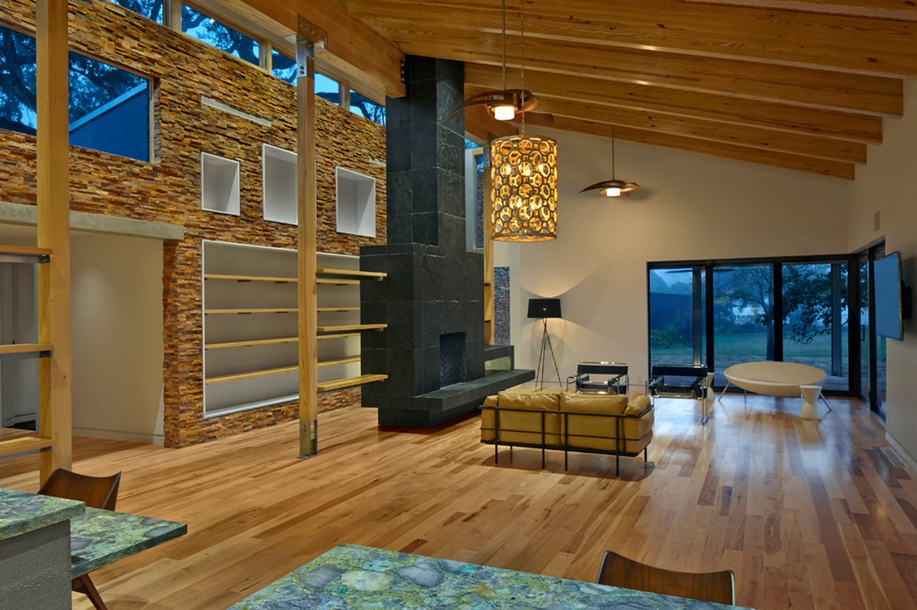 Ochre Stacked Stone Feature Wall with built in bookshelves