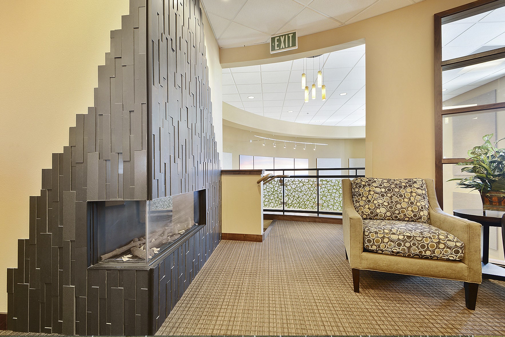 Basalt Grey Stone Veneer Panel on Corner Fireplace in bank lobby