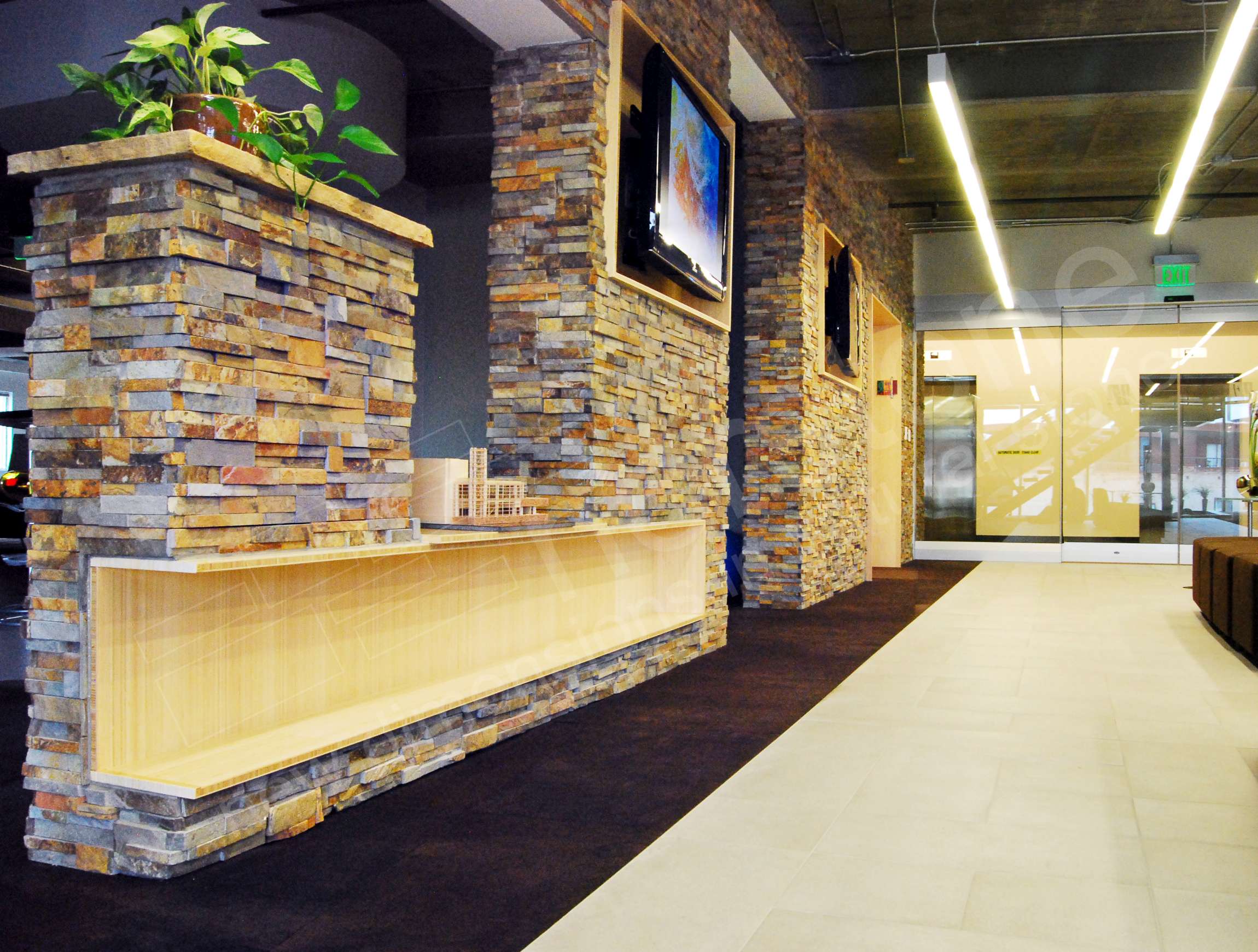 Ochre Stacked Stone Dividing Wall in Architecture Firm office Denver