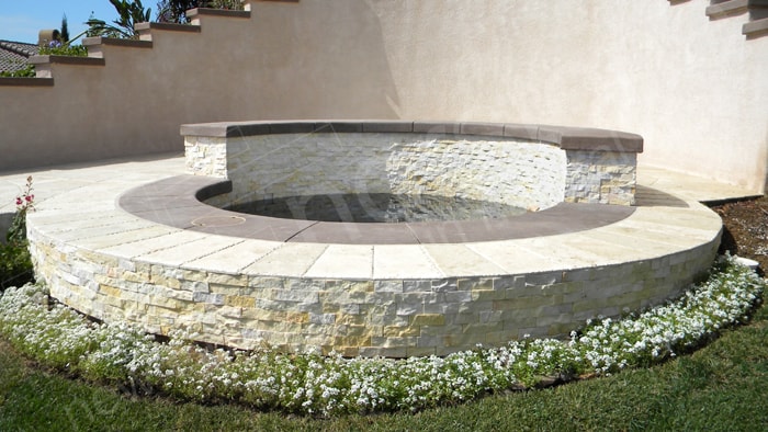 Stacked Stone Concave and Convex Curved Wall Outdoor Hot Tub