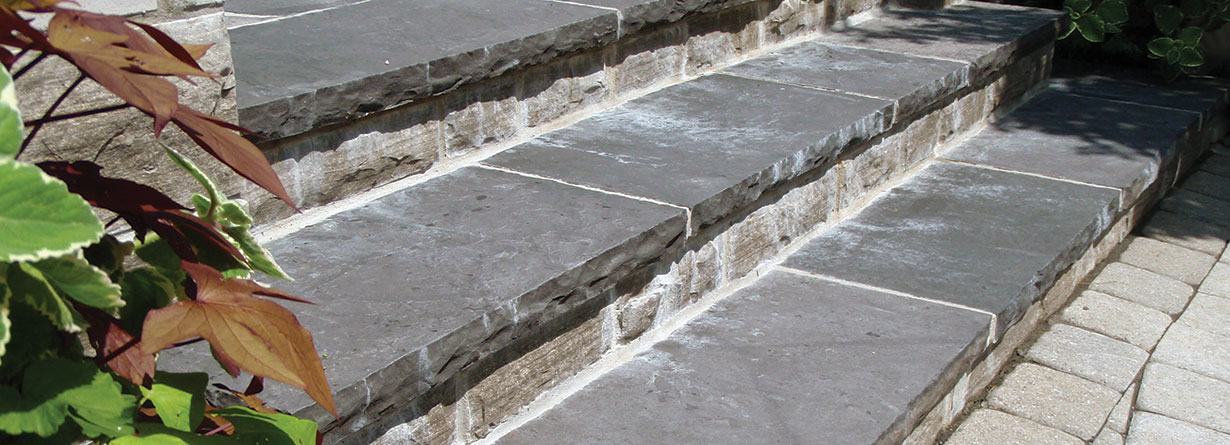 Effloresence showing on the face of natural stone used as the risers on outdoor steps