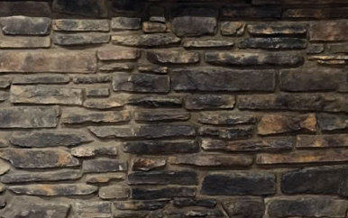 Stone veneer that has been sealed on one side and left unsealed on the other side to show the difference in sheen