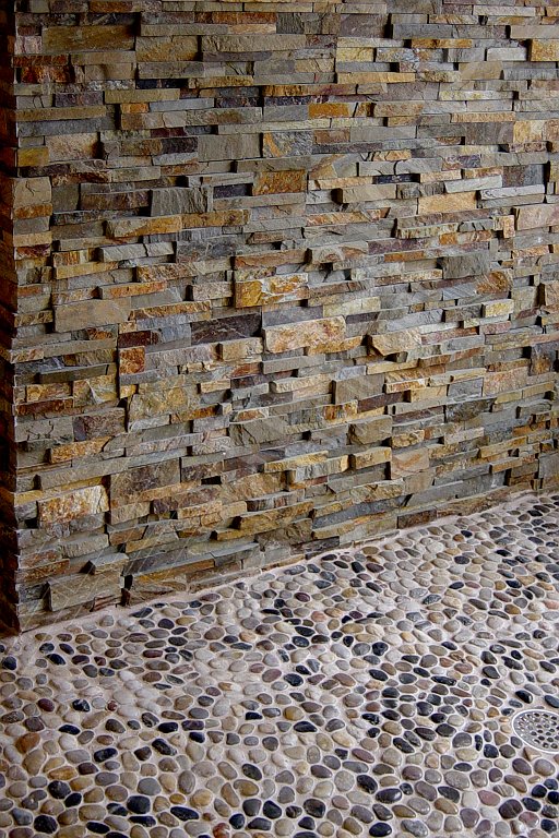 Stacked Stone Shower Feature Wall that has been sealed to protect and enhance the stone